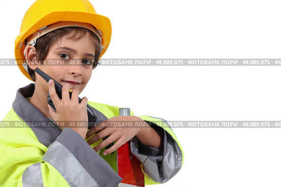 Young boy pretending to be a traffic guard. Стоковое фото, агентство Ingram Publishing / Фотобанк Лори