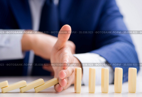 Young businessman playing with domino in office. Стоковое фото, фотограф Elnur / Фотобанк Лори