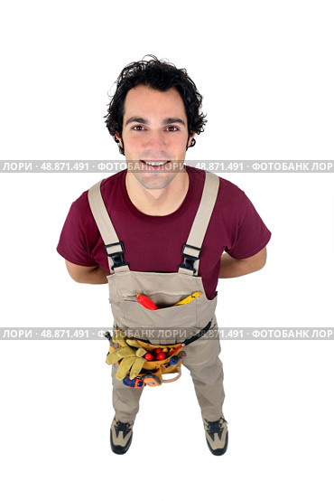 young handyman facing the camera. Стоковое фото, агентство Ingram Publishing / Фотобанк Лори