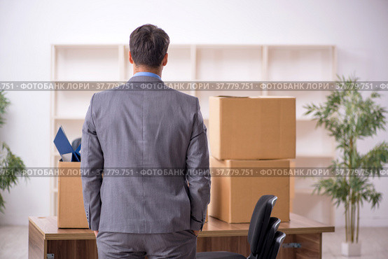 Young male employee in office relocation concept. Стоковое фото, фотограф Elnur / Фотобанк Лори