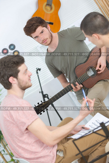 young men together in a music studio. Стоковое фото, агентство Ingram Publishing / Фотобанк Лори