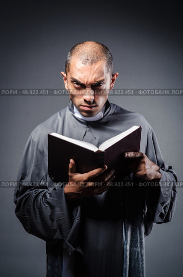 Young priest isolated on the white. Стоковое фото, агентство Ingram Publishing / Фотобанк Лори