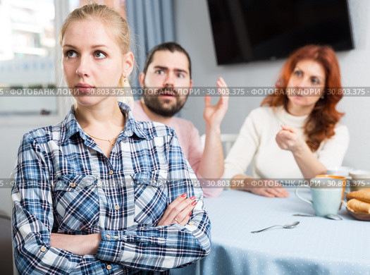 Young spouses and mother-in-low arguing indoors. Стоковое фото, фотограф Яков Филимонов / Фотобанк Лори