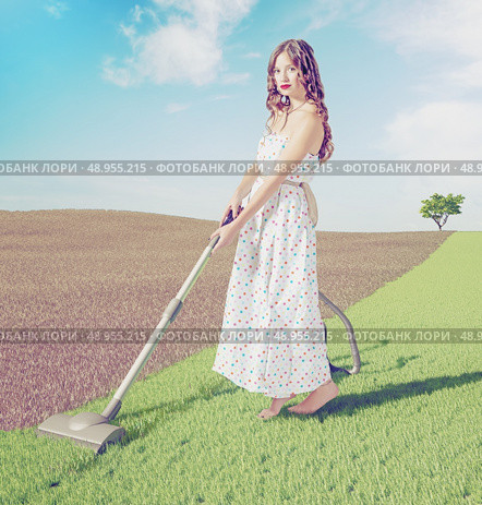 Young woman cleaning natural green grass  in wild  landscape. Creative concept photo combinated. Стоковое фото, агентство Ingram Publishing / Фотобанк Лори