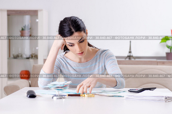Young woman in budget planning concept. Стоковое фото, фотограф Elnur / Фотобанк Лори