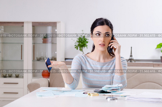 Young woman in budget planning concept. Стоковое фото, фотограф Elnur / Фотобанк Лори