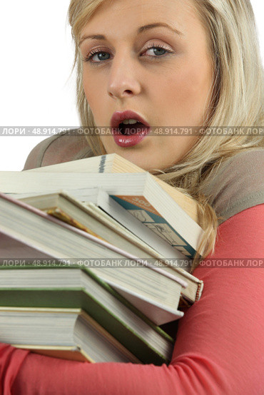 Young woman overworked with a stack of books. Стоковое фото, агентство Ingram Publishing / Фотобанк Лори