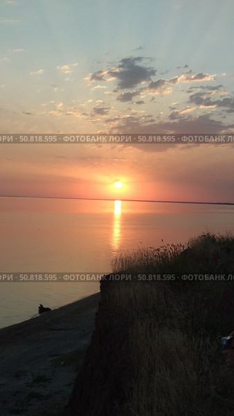 Закат над морем в степной местности. Стоковое фото, фотограф Мария Сергеева / Фотобанк Лори
