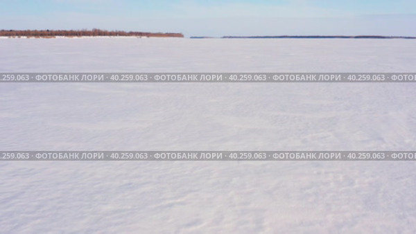 Западная Сибирь: река Обь зимой. Вид с воздуха. Western Siberia: the Ob River in winter. Aerial view. Стоковое видео, видеограф Евгений Романов / Фотобанк Лори